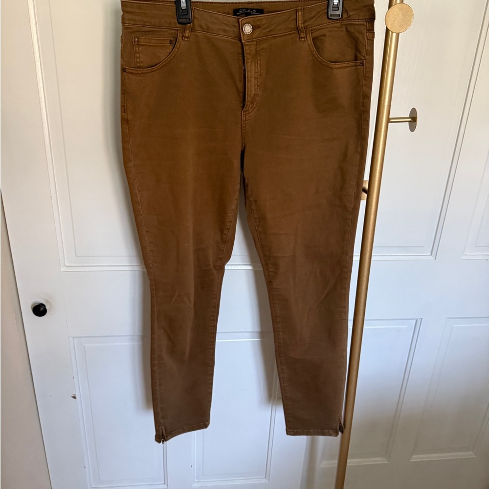 Charlie B ankle length with a small zipper on each pant leg brownish gold color